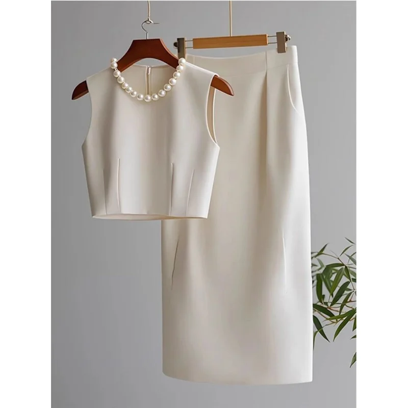 Женский темперамент, однотонный топ без рукавов с круглым вырезом, юбка трапециевидной формы с высокой талией, костюм из двух предметов, модные расклешенные комплекты с вышивкой 
Женский темперамент, однотонный топ без рукавов с круглым вырезом, юбка трапециевидной формы с высокой талией, костюм из двух предметов, модные расклешенные комплекты с вышивкой