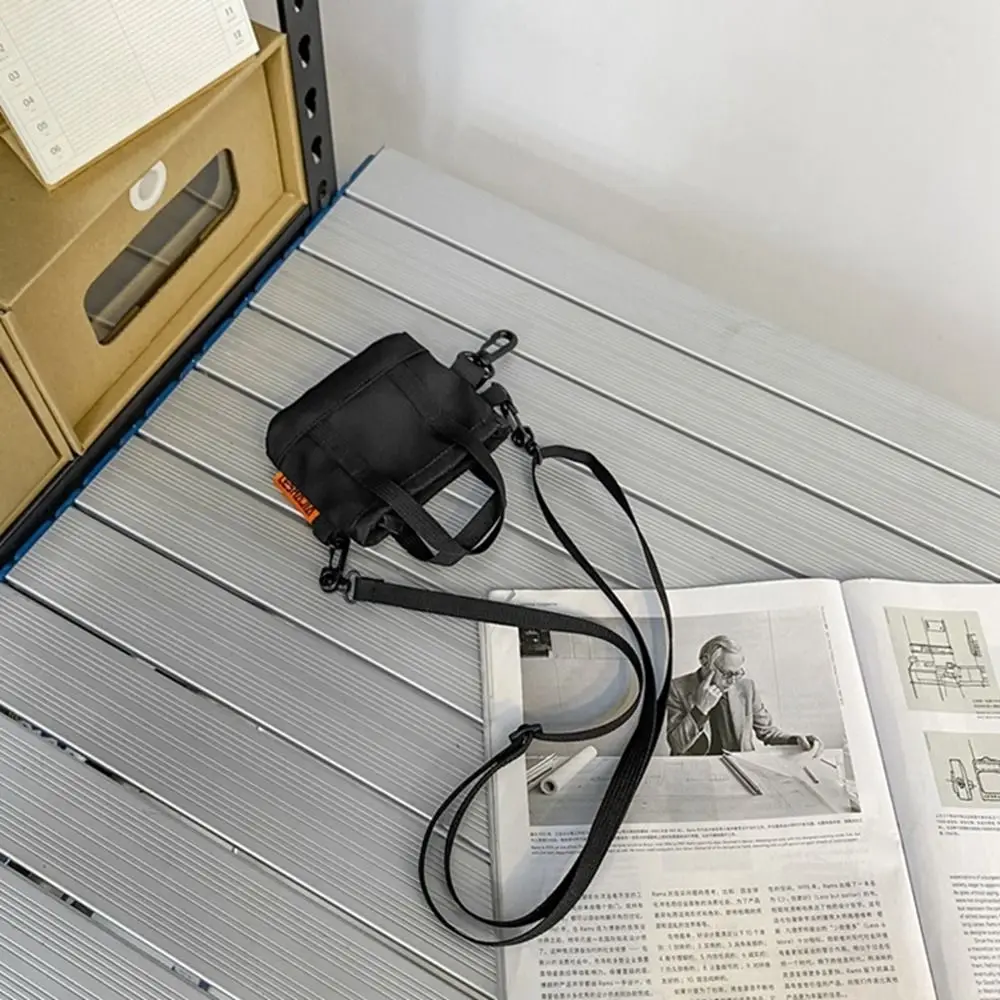 Practical Portable Nylon Coin Purse Pendant Keychain Korean Style Men Wallet Zipper Pouch Card Holder Mini Crossbody Bag Girls
Practical Portable Nylon Coin Purse Pendant Keychain Korean Style Men Wallet Zipper Pouch Card Holder Mini Crossbody Bag Girls