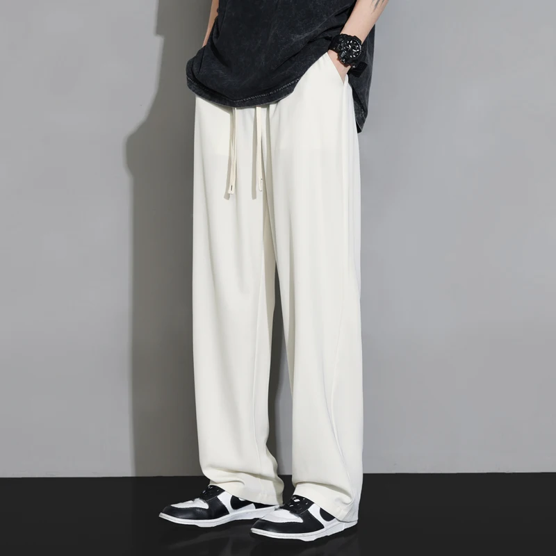 Мужские летние тонкие брюки из ледяного шелка, широкие, свободные, повседневные, длинные, белые, прямого кроя, модные, дышащие, легкие
Мужские летние тонкие брюки из ледяного шелка, широкие, свободные, повседневные, длинные, белые, прямого кроя, модные, дышащие, легкие