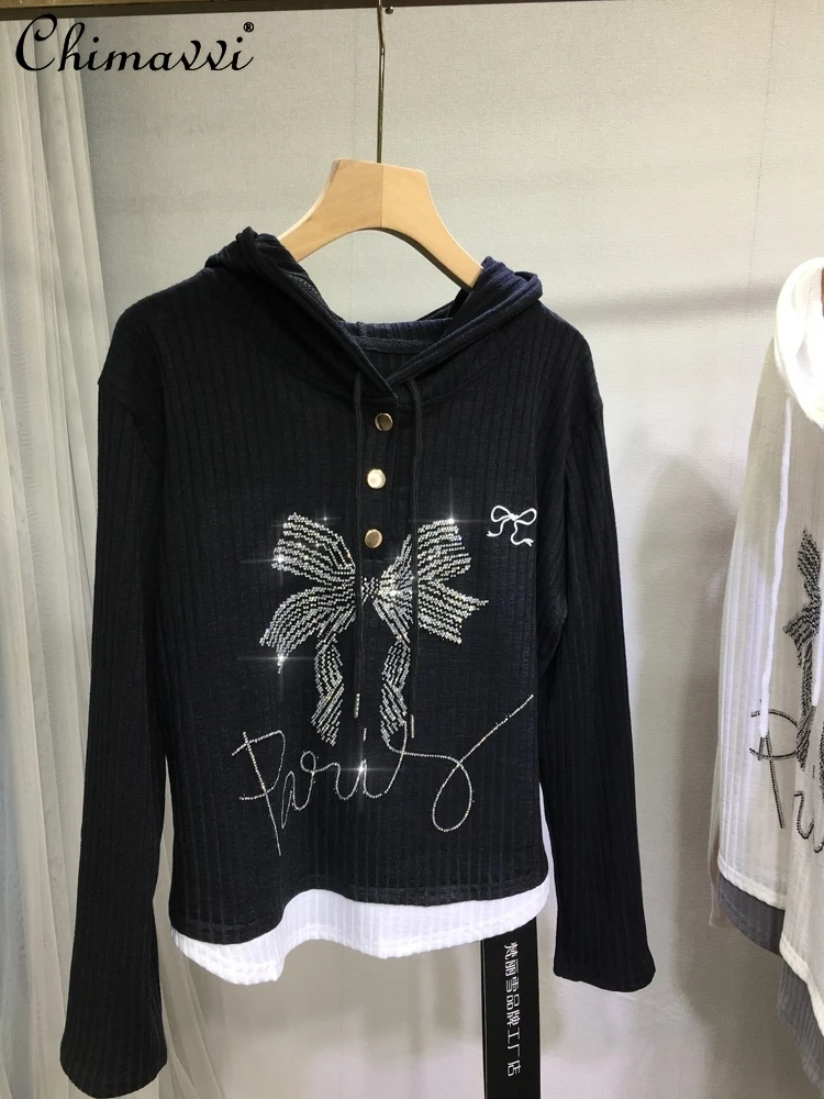 European Heavy Hot Diamond T-shirt Female Fake Two Pieces Fashion Bow Black Cotton Top Long Sleeve Bottoming Shirt Spring Summer
European Heavy Hot Diamond T-shirt Female Fake Two Pieces Fashion Bow Black Cotton Top Long Sleeve Bottoming Shirt Spring Summer