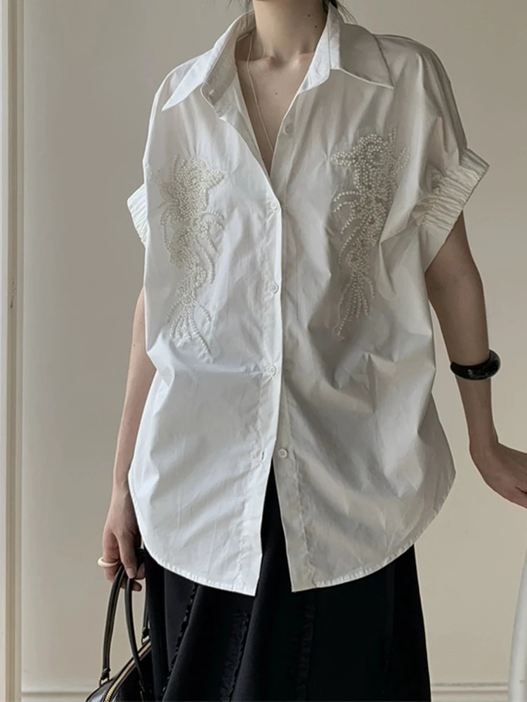 Heavy sequined beaded design lapel single-breasted loose shirt summer new temperament Joker irregular long blouse.
Heavy sequined beaded design lapel single-breasted loose shirt summer new temperament Joker irregular long blouse.