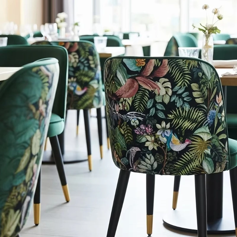 green velvet dining chair with tropical print backrest and black metal legs, suitable for commercial restaurants, hotels, cafes
green velvet dining chair with tropical print backrest and black metal legs, suitable for commercial restaurants, hotels, cafes