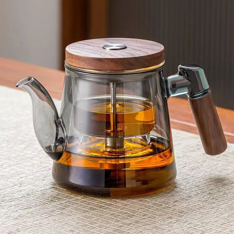 The all-glass inner pot of the teapot is a household push-button tea-water separation cup with a floating design 
The all-glass inner pot of the teapot is a household push-button tea-water separation cup with a floating design