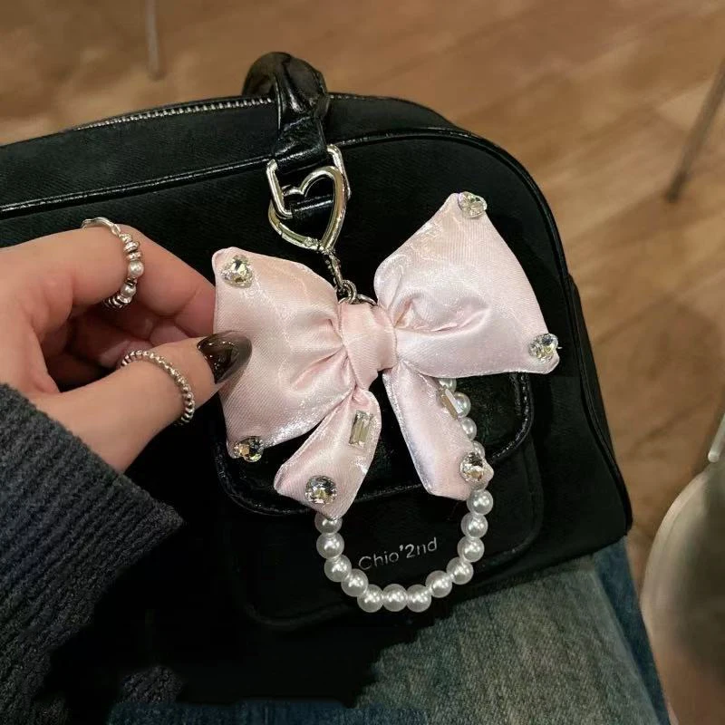 New Imitation Pearl String Bow Keychain Three-Dimensional Color Mobile Phone Bag Hanging Decoration Key Ring Wholesale
New Imitation Pearl String Bow Keychain Three-Dimensional Color Mobile Phone Bag Hanging Decoration Key Ring Wholesale