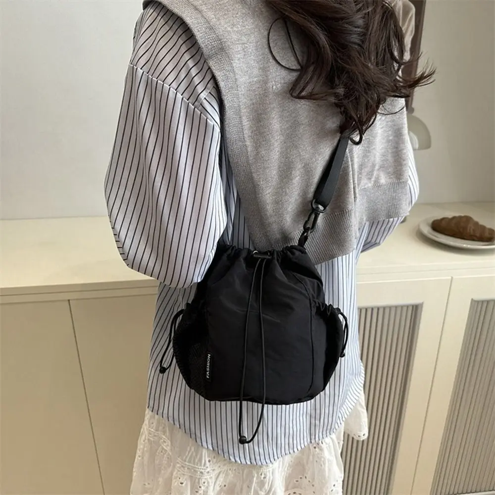 Sweet Korean Style Drawstring Bucket Bag Handbag Purse Nylon Shoulder Bag Mobile Phone Bag Solid Color Small Crossbody Bag Women
Sweet Korean Style Drawstring Bucket Bag Handbag Purse Nylon Shoulder Bag Mobile Phone Bag Solid Color Small Crossbody Bag Women