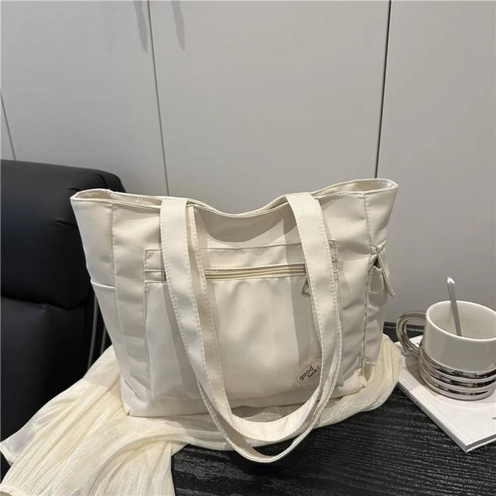Trendy Korean Large Capacity Tote Bag Solid Color Light Weight Women's Shoulder Bag Casual Versatile Student Handbag Commuting
Trendy Korean Large Capacity Tote Bag Solid Color Light Weight Women's Shoulder Bag Casual Versatile Student Handbag Commuting