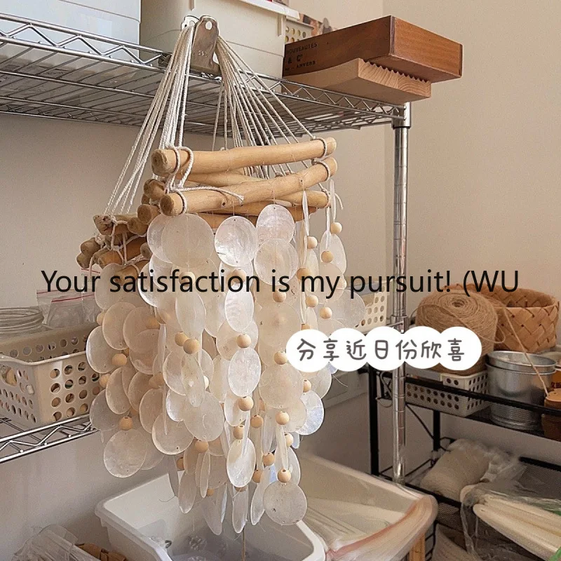 Handmade natural shell wind chimes, retro style decoration, aerial pendant, material package, homestay children's room pendant. 
Handmade natural shell wind chimes, retro style decoration, aerial pendant, material package, homestay children's room pendant.