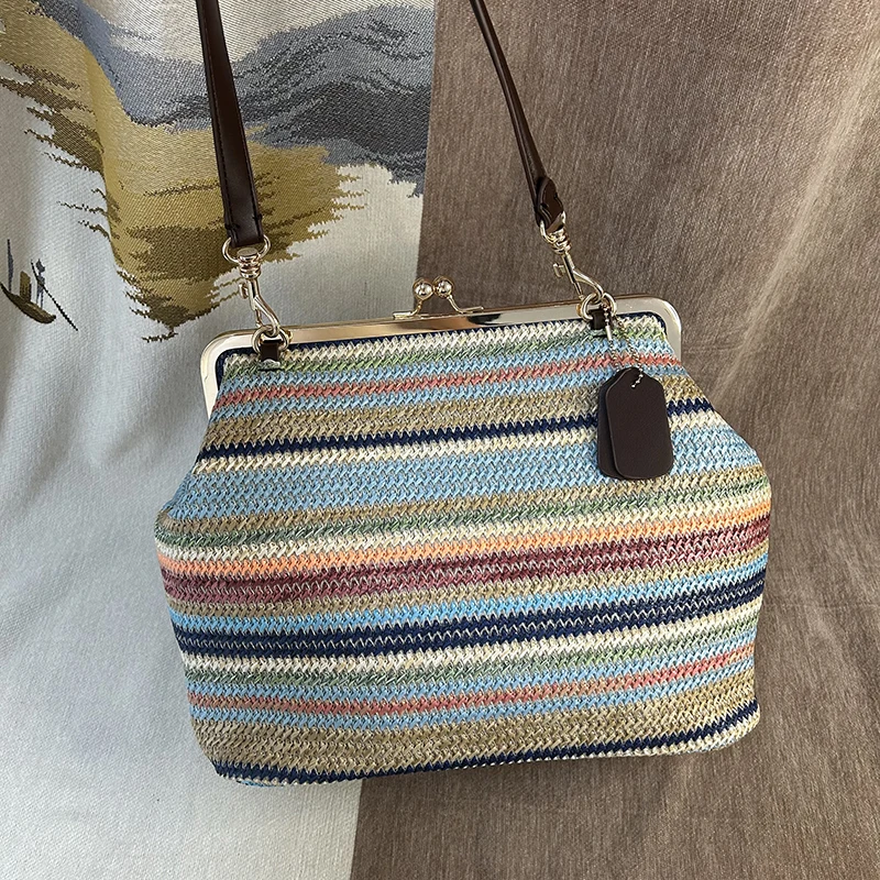 CLAREGQI Rainbow Striped Crochet Woven Kiss Lock Shoulder Bag Vintage Summer Beach Clasp Purse Women Bohemian Striped Straw Wove
CLAREGQI Rainbow Striped Crochet Woven Kiss Lock Shoulder Bag Vintage Summer Beach Clasp Purse Women Bohemian Striped Straw Wove