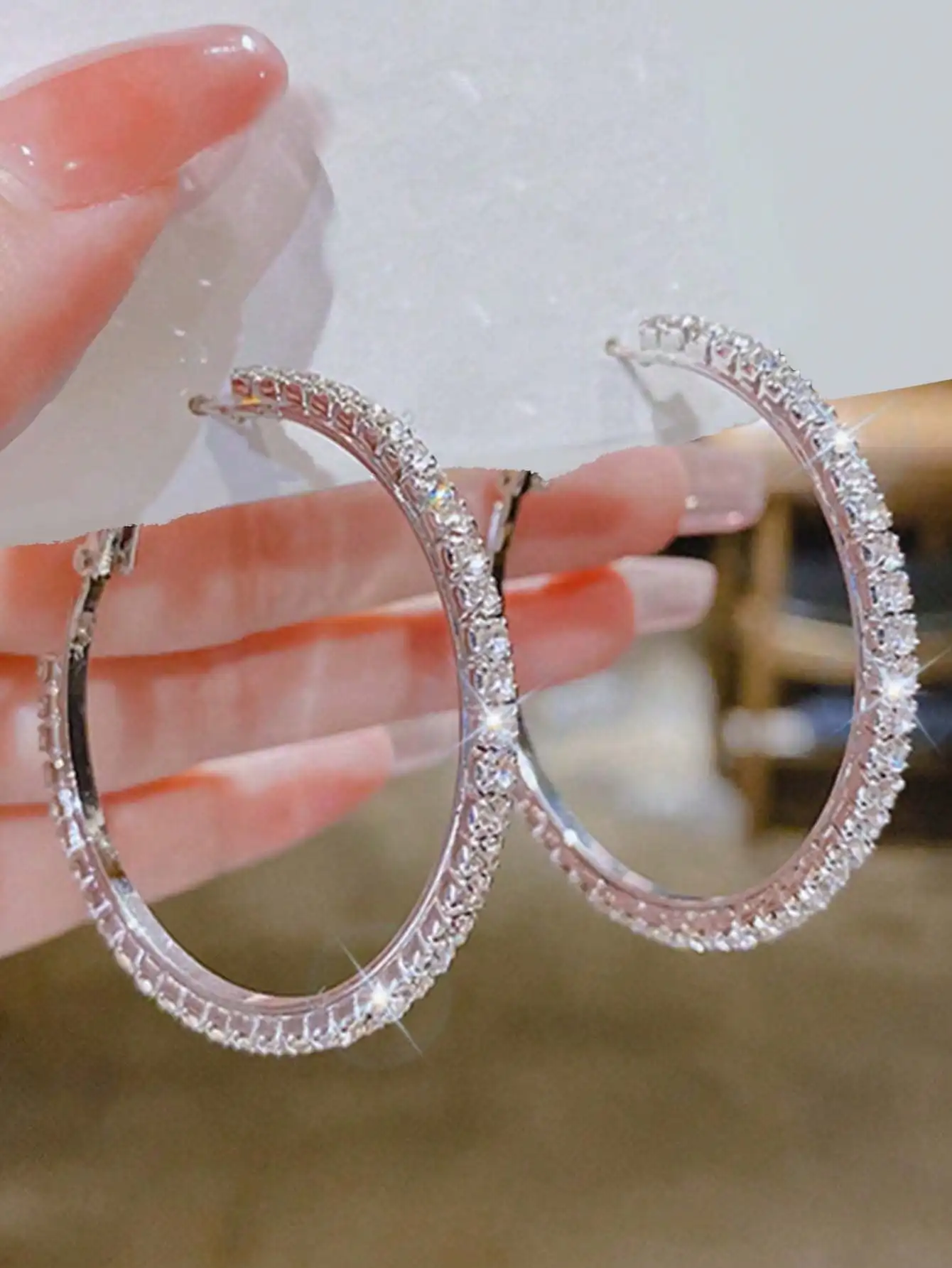 Sparkling Silver Hoop Earrings with Full Rhinestone Embellishment for Women
Sparkling Silver Hoop Earrings with Full Rhinestone Embellishment for Women