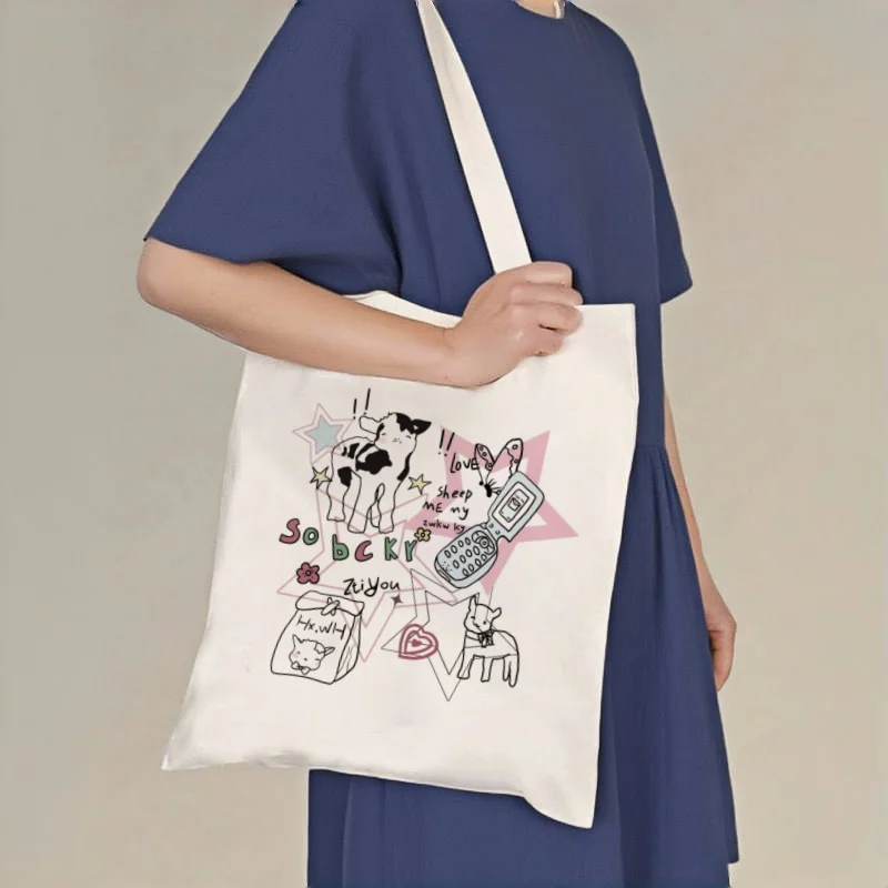 1pc Cute Cow & Flip Phone Print Canvas Tote Bag, Y2K Aesthetic Shoulder Bag
1pc Cute Cow & Flip Phone Print Canvas Tote Bag, Y2K Aesthetic Shoulder Bag