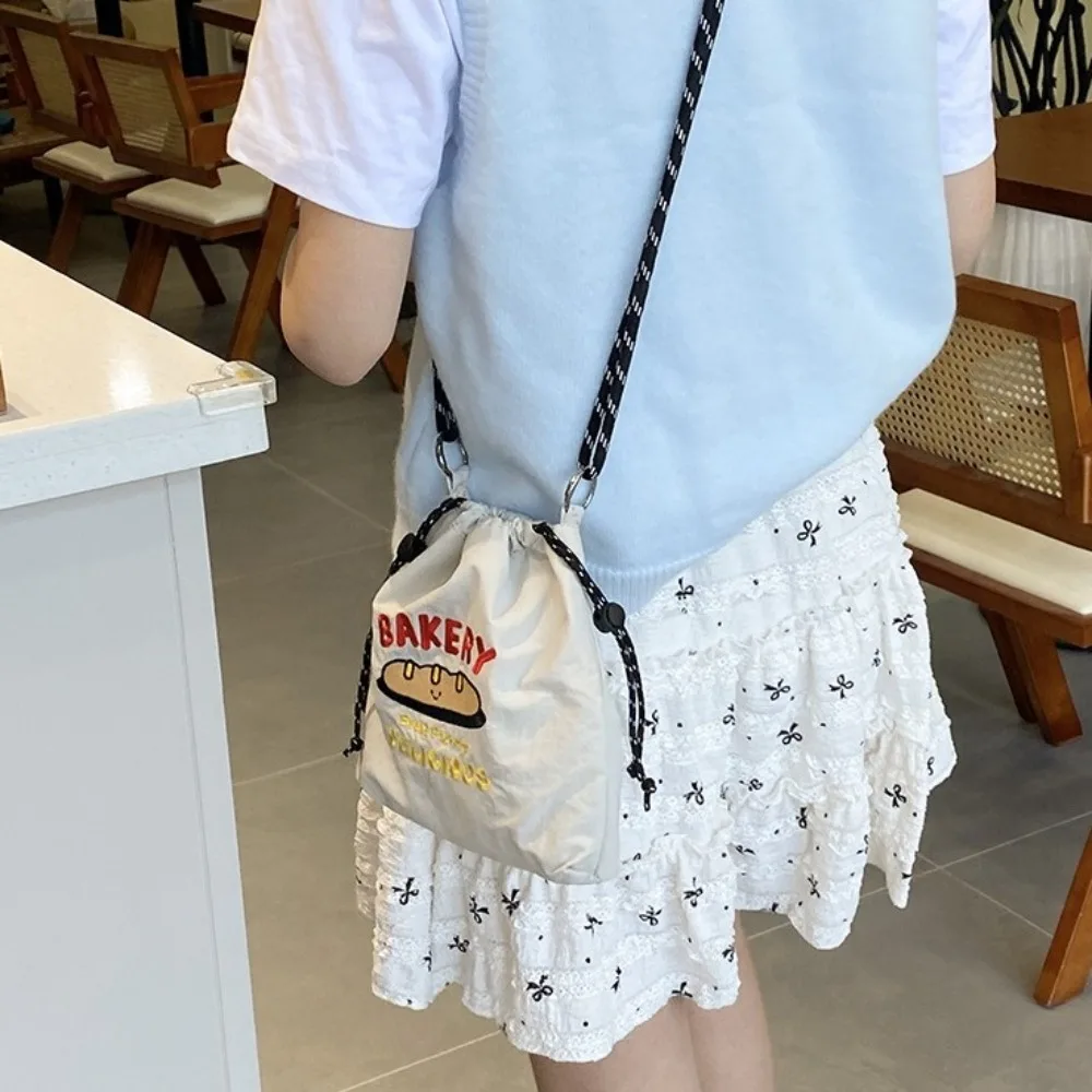 Cartoon Nylon Shoulder Bag Embroidery Multicolor Drawstring Crossbody Bag Large Capacity Coin Pouch Mobile Phone Pack Male
Cartoon Nylon Shoulder Bag Embroidery Multicolor Drawstring Crossbody Bag Large Capacity Coin Pouch Mobile Phone Pack Male