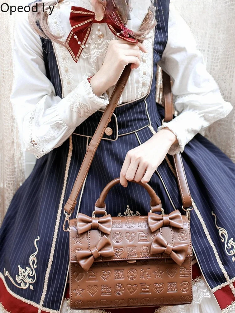 Sweetheart Girl Chocolate Lolita Original Design Handbag Small Capacity Retro Elegant Bow Embossed Commuter Style Crossbody Bag
Sweetheart Girl Chocolate Lolita Original Design Handbag Small Capacity Retro Elegant Bow Embossed Commuter Style Crossbody Bag
