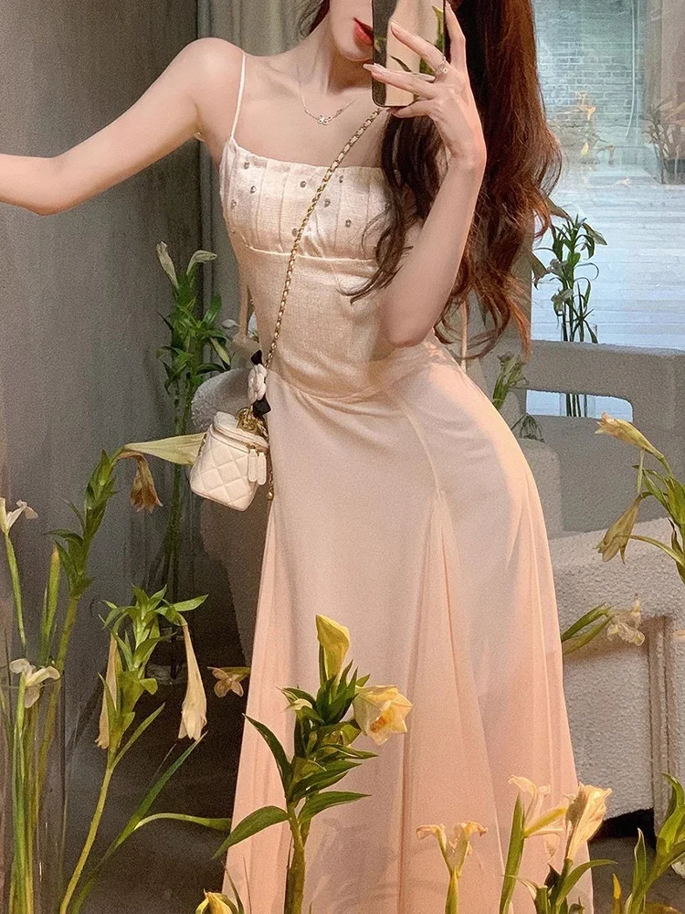 Korean Female Clothes Casual Elegant Dress for Woman Sleeveless Slim Sweet Solid Slash Neck Spaghetti Strap New Summer Dress
Korean Female Clothes Casual Elegant Dress for Woman Sleeveless Slim Sweet Solid Slash Neck Spaghetti Strap New Summer Dress