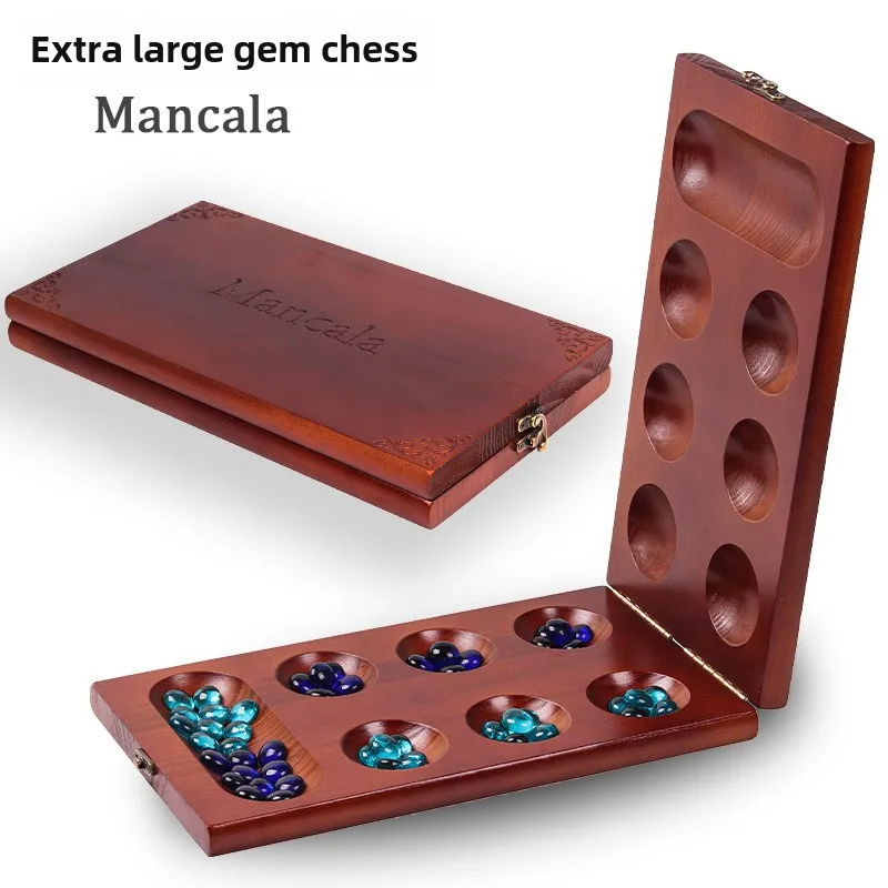 Древние африканские шахматы Mancala: набор шахмат из цельного дерева в сочетании с изысканными каменными гранулами и идеальными настольными играми.
Древние африканские шахматы Mancala: набор шахмат из цельного дерева в сочетании с изысканными каменными гранулами и идеальными настольными играми.