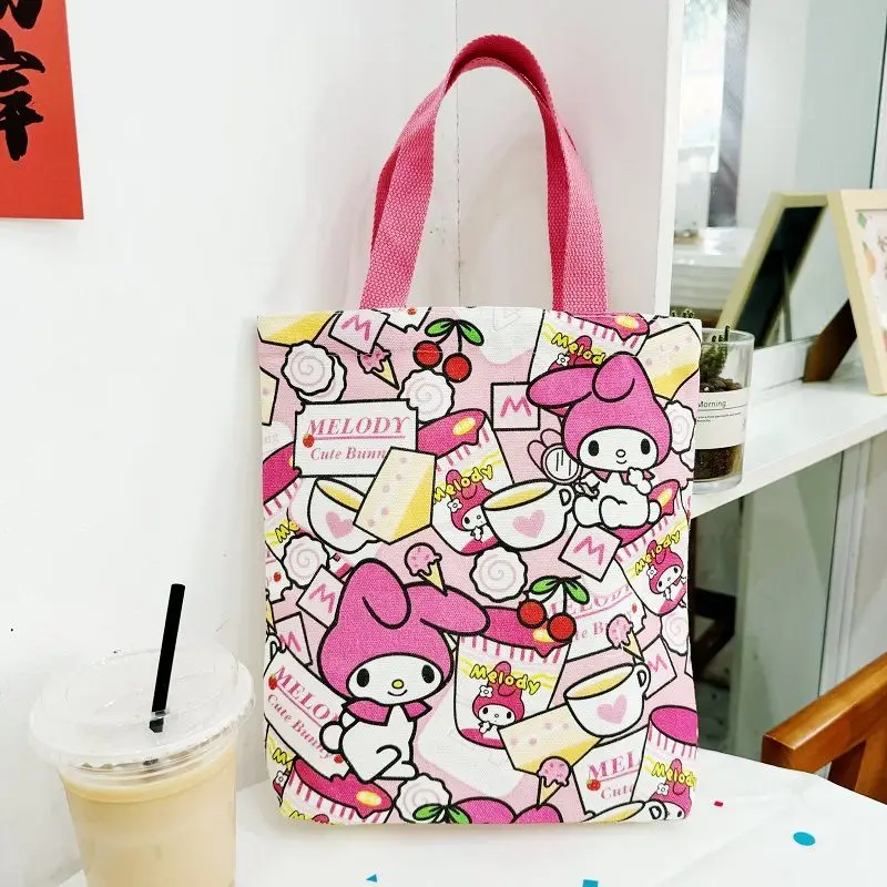 Hello Kitty PomPomPurin Anime Canvas Bag for Women New Cute Cartoon Commuting Cloth Bag Bento Box Storage Handbag Gifts
Hello Kitty PomPomPurin Anime Canvas Bag for Women New Cute Cartoon Commuting Cloth Bag Bento Box Storage Handbag Gifts
