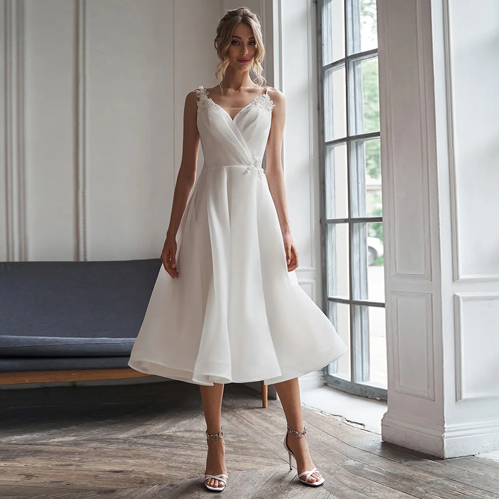 Short Wedding Dress 2026 A Line V Neck Simple Wedding Gown White Organza Satin Backless Tea Length Sleeveless Midi Bridal Dress
Short Wedding Dress 2026 A Line V Neck Simple Wedding Gown White Organza Satin Backless Tea Length Sleeveless Midi Bridal Dress