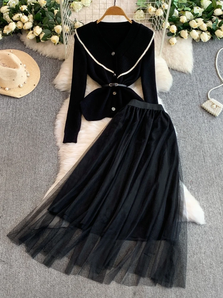 Легкая роскошная вязаная куртка с металлической цветочной пряжкой на талии и рюшами по краям + длинная юбка из сетки для феи, элегантный комплект из двух предметов
Легкая роскошная вязаная куртка с металлической цветочной пряжкой на талии и рюшами по краям + длинная юбка из сетки для феи, элегантный комплект из двух предметов