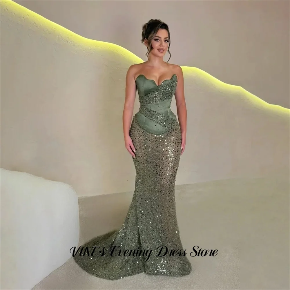 Оливково-зеленые выпускные платья VINES, вечерние платья-русалка с вырезом в форме сердца и блестящими пайетками, арабские вечерние платья для торжественных мероприятий, индивидуальный пошив
Оливково-зеленые выпускные платья VINES, вечерние платья-русалка с вырезом в форме сердца и блестящими пайетками, арабские вечерние платья для торжественных мероприятий, индивидуальный пошив
