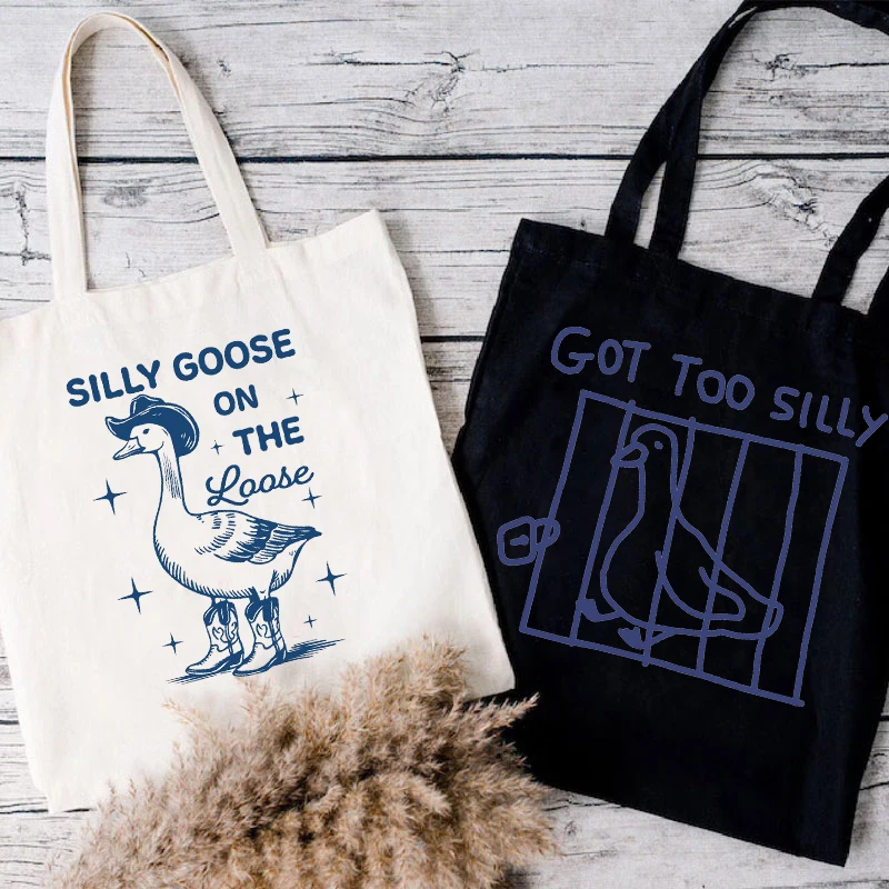 Silly Goose on The Loose Retro Canvas Tote Bag Women Men Reusable Shopper Bag Harajuku Fashion Goose Shoulder Tote Handbags
Silly Goose on The Loose Retro Canvas Tote Bag Women Men Reusable Shopper Bag Harajuku Fashion Goose Shoulder Tote Handbags