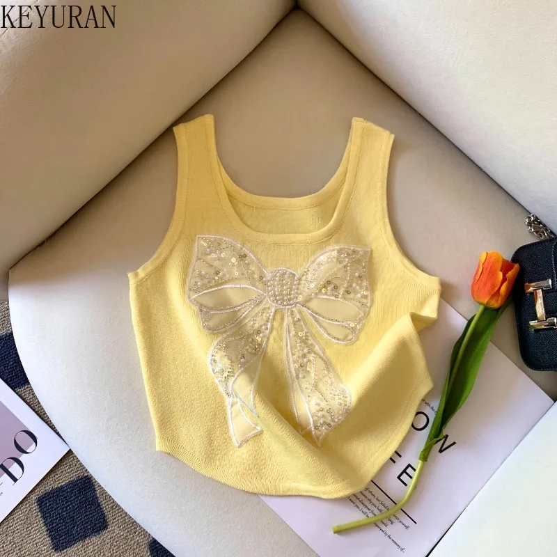 2025 Summer Yellow Beading Bow Knit Vests Women Vintage Chic Sleeveless Sweater Pullovers Knitwear Slim Crop Tops Ladies Jumpers
2025 Summer Yellow Beading Bow Knit Vests Women Vintage Chic Sleeveless Sweater Pullovers Knitwear Slim Crop Tops Ladies Jumpers