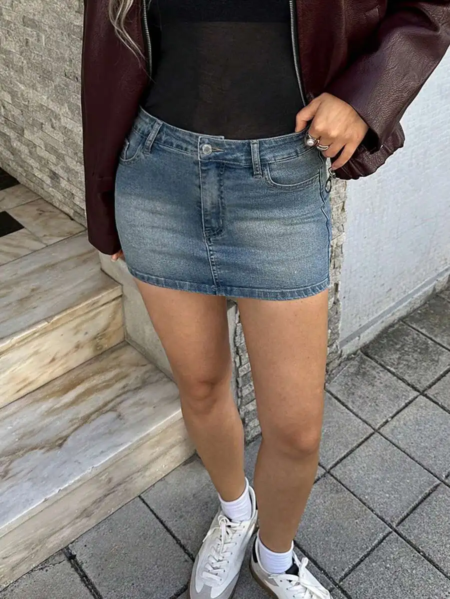 Washed Blue Denim Mini Skirt with Front Button Closure and Pockets
Washed Blue Denim Mini Skirt with Front Button Closure and Pockets