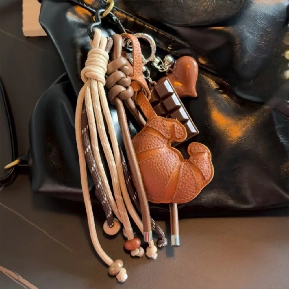 New Braided Rope Croissant Keychain Bread Shape Heart Mobile Phone Lanyard Leather Chocolate Bag Pendant Bag Decoration
New Braided Rope Croissant Keychain Bread Shape Heart Mobile Phone Lanyard Leather Chocolate Bag Pendant Bag Decoration