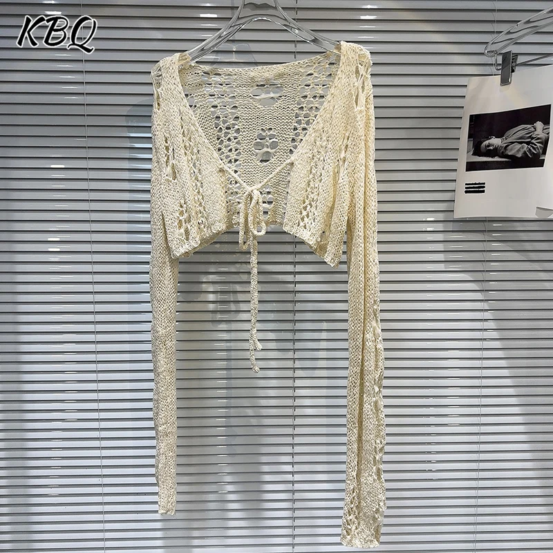 KBQ Solid Hollow Out Loose Chi Spliced Lace Up Knitted Cardigan for Women V Neck Long Sleeve Minimalist Short Tops Female Style
KBQ Solid Hollow Out Loose Chi Spliced Lace Up Knitted Cardigan for Women V Neck Long Sleeve Minimalist Short Tops Female Style