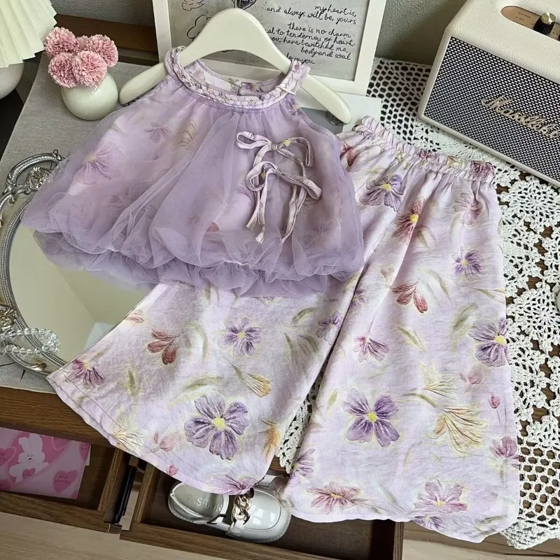 Summer girls' suit new 2025 mesh bow vest shirt printed wide-legged trousers country style two-piece set
Summer girls' suit new 2025 mesh bow vest shirt printed wide-legged trousers country style two-piece set