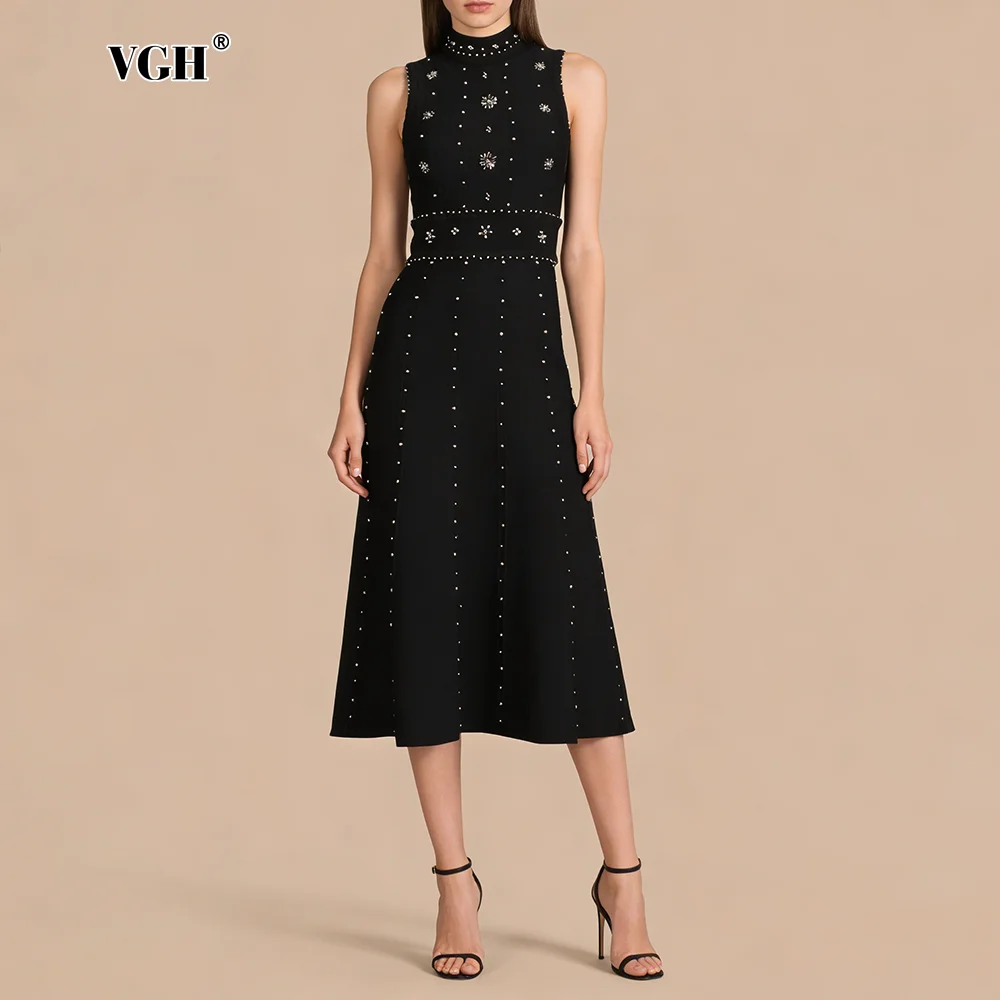VGH Черное стильное миди-платье без рукавов для городских встреч, женское, с высоким воротом, с декоративными заклепками, вязаное, с открытой спиной, для деловых ужинов
VGH Черное стильное миди-платье без рукавов для городских встреч, женское, с высоким воротом, с декоративными заклепками, вязаное, с открытой спиной, для деловых ужинов
