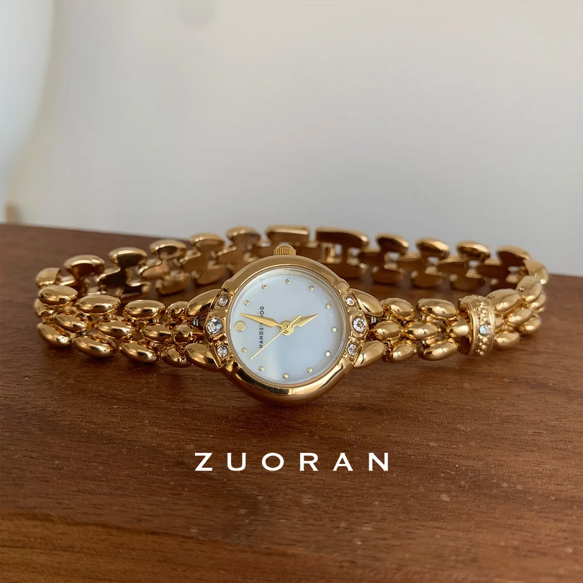 New, elegant and sophisticated gold-tone round dial women's watch, a high-end luxury women's wristwatch and watch accessory.
New, elegant and sophisticated gold-tone round dial women's watch, a high-end luxury women's wristwatch and watch accessory.