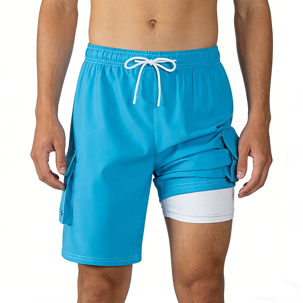 Мужские спортивные шорты-карго синего цвета с эластичным поясом на шнурке, быстросохнущие, с надежными накладными карманами и внутренними трусиками
Мужские спортивные шорты-карго синего цвета с эластичным поясом на шнурке, быстросохнущие, с надежными накладными карманами и внутренними трусиками