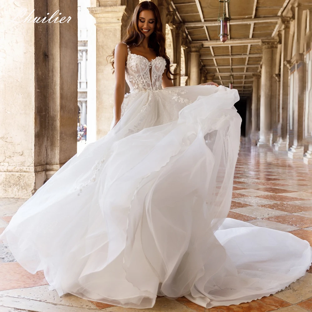 Lhuilier Customized A Line Wedding Dresses Sleeveless Shiny Tulle Illusion Beaded Lace Bridal Gown with Chapel Train
Lhuilier Customized A Line Wedding Dresses Sleeveless Shiny Tulle Illusion Beaded Lace Bridal Gown with Chapel Train