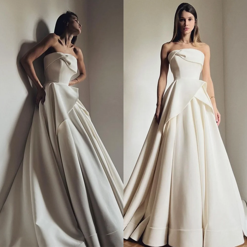 Customized Exquisite White Satin Wedding Dress Elegant Strapless Sleeveless Bridal Gowns Chapel Train Backless Robe de mariée
Customized Exquisite White Satin Wedding Dress Elegant Strapless Sleeveless Bridal Gowns Chapel Train Backless Robe de mariée