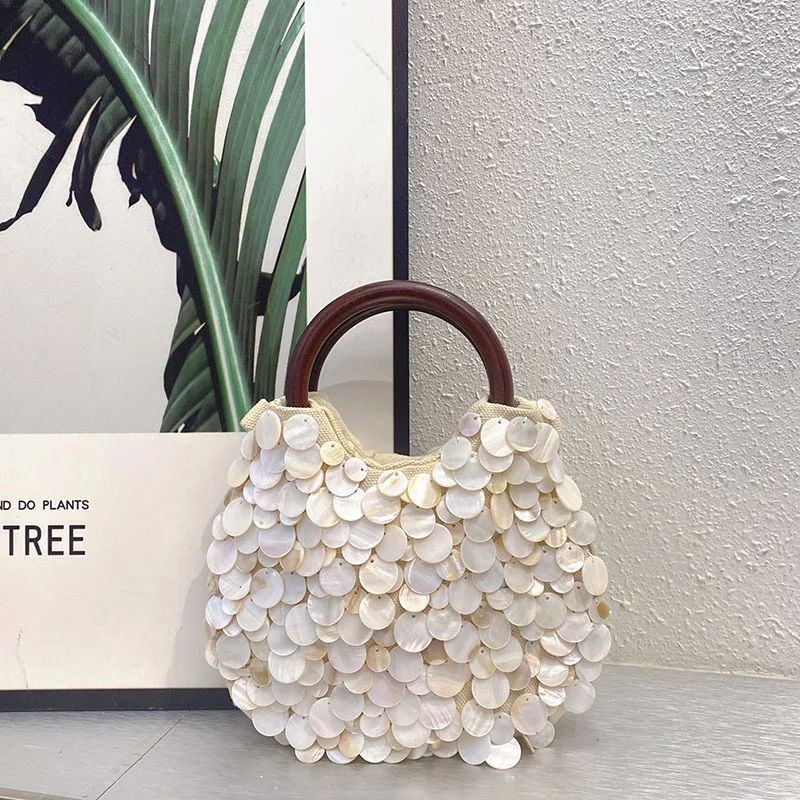 Spring and summer new high-end pure handmade natural shell bag fairy handheld bag personalized trend niche bag
Spring and summer new high-end pure handmade natural shell bag fairy handheld bag personalized trend niche bag