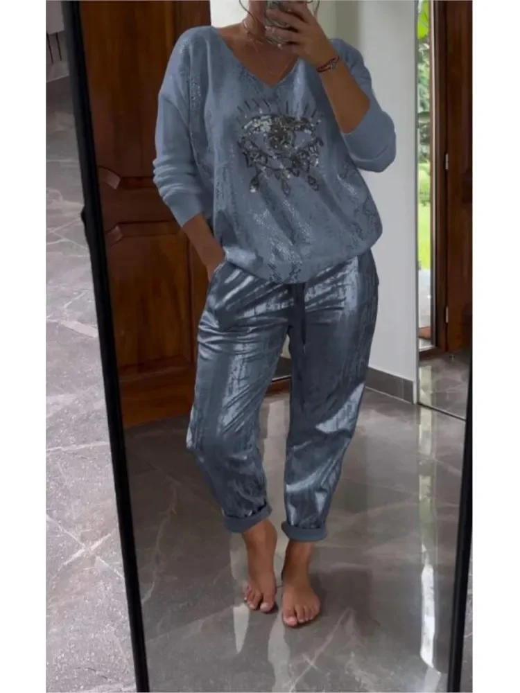 Spring Long-sleeved V Neck Top Pullover+Bronzing Pants Outfit Summer Lace-up Loose Suit Gold Shining Eye Print Women 2 Piece Set
Spring Long-sleeved V Neck Top Pullover+Bronzing Pants Outfit Summer Lace-up Loose Suit Gold Shining Eye Print Women 2 Piece Set