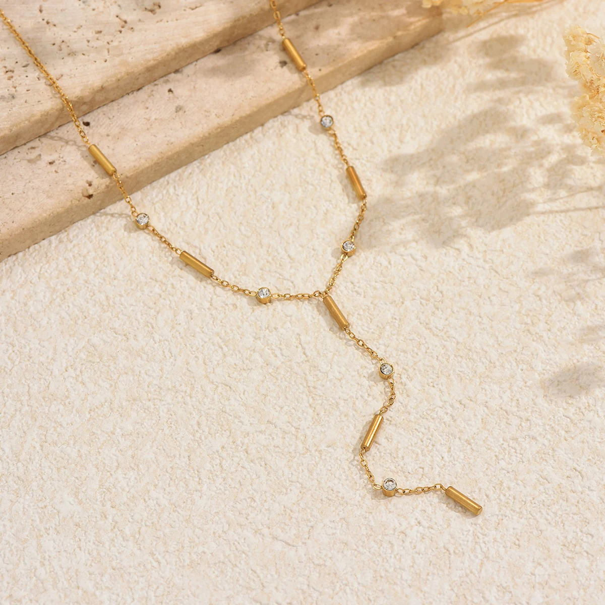 Lxalry Gold Plated Necklace with Dangle Design - Minimalist Luxury Jewelry with Gemstone Accents and Flowing Lines 
Lxalry Gold Plated Necklace with Dangle Design - Minimalist Luxury Jewelry with Gemstone Accents and Flowing Lines