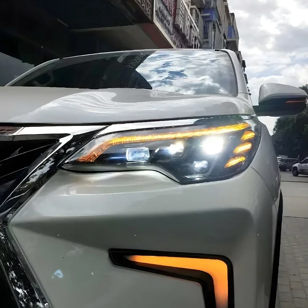 Для Toyota Fortuner 2016-2020 автомобильные передние фонари, обновленный проектор в стиле Lexus, аксессуары с четырьмя линзами, светодиодные автомобильные фары в сборе
Для Toyota Fortuner 2016-2020 автомобильные передние фонари, обновленный проектор в стиле Lexus, аксессуары с четырьмя линзами, светодиодные автомобильные фары в сборе
