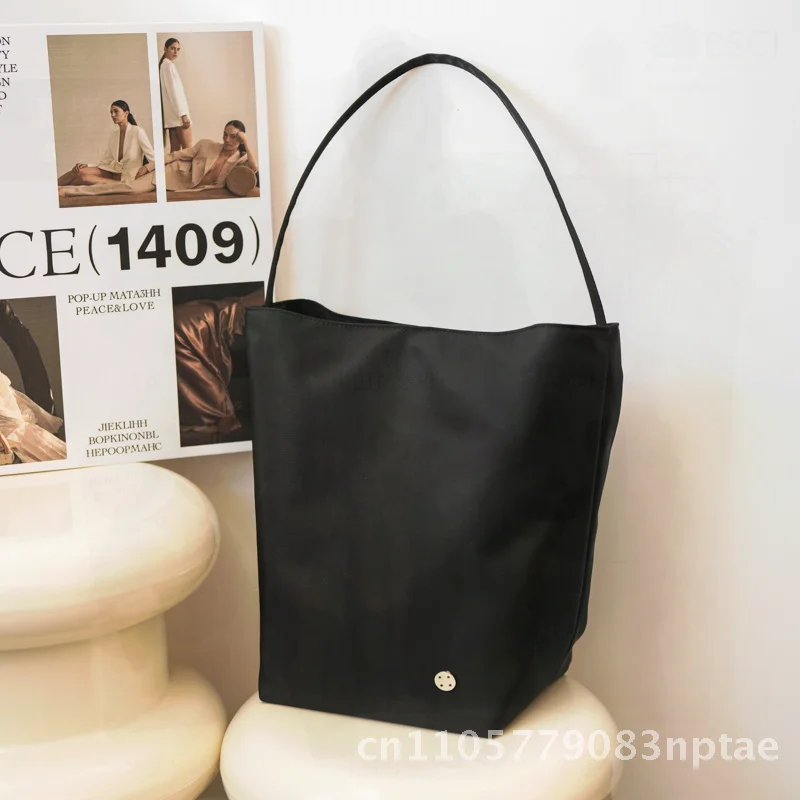 Nylon Bucket Bag for Women Lightweight Large Capacity Urban Minimalist Style Fashion Shoulder Bag with Hidden Zipper Pocket
Nylon Bucket Bag for Women Lightweight Large Capacity Urban Minimalist Style Fashion Shoulder Bag with Hidden Zipper Pocket