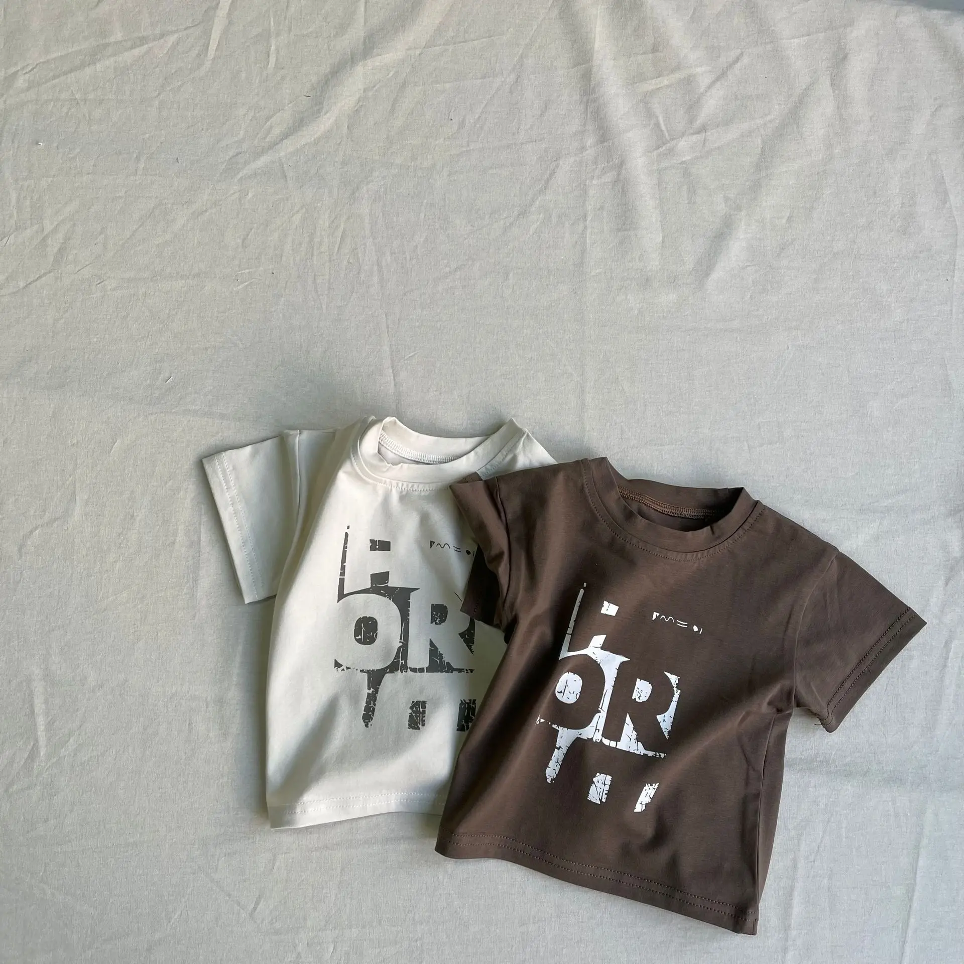 Children's Short Sleeved T-shirt Summer New Item for Boys and Girls Baby Korean Version Soft T-shirt Top Trendy Puzzle Pattern
Children's Short Sleeved T-shirt Summer New Item for Boys and Girls Baby Korean Version Soft T-shirt Top Trendy Puzzle Pattern