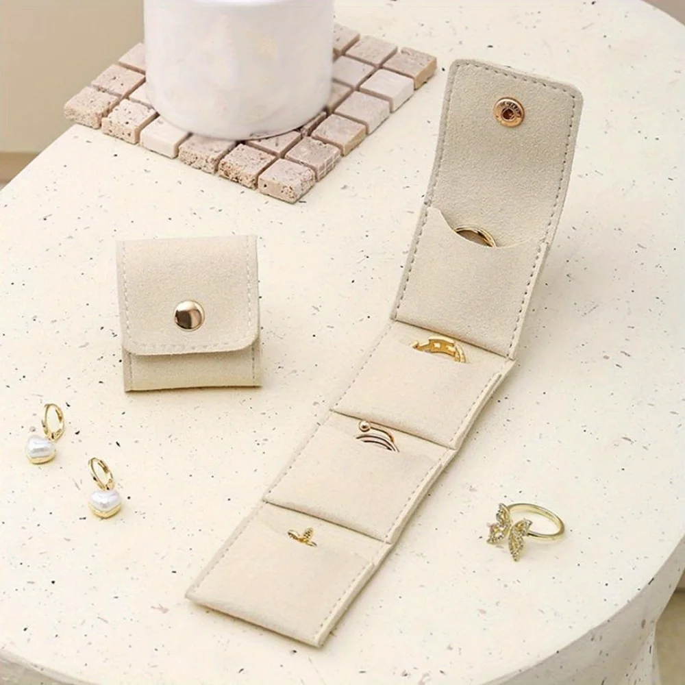 Мини-дорожная сумка для ювелирных изделий с пряжкой, портативная складная дорожная коробка для хранения ювелирных изделий, маленькая шкатулка для драгоценностей для сережек, колец
Мини-дорожная сумка для ювелирных изделий с пряжкой, портативная складная дорожная коробка для хранения ювелирных изделий, маленькая шкатулка для драгоценностей для сережек, колец