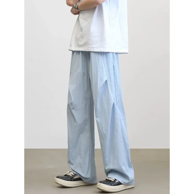 Мужские светло-голубые широкие брюки с текстурой морщин, повседневные свободные брюки с завязками на талии
Мужские светло-голубые широкие брюки с текстурой морщин, повседневные свободные брюки с завязками на талии