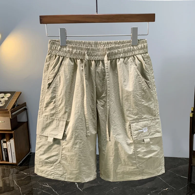 Летние тонкие мужские шорты для спецодежды, модные повседневные спортивные свободные крутые быстросохнущие брюки из ледяного шелка пяти четвертей
Летние тонкие мужские шорты для спецодежды, модные повседневные спортивные свободные крутые быстросохнущие брюки из ледяного шелка пяти четвертей