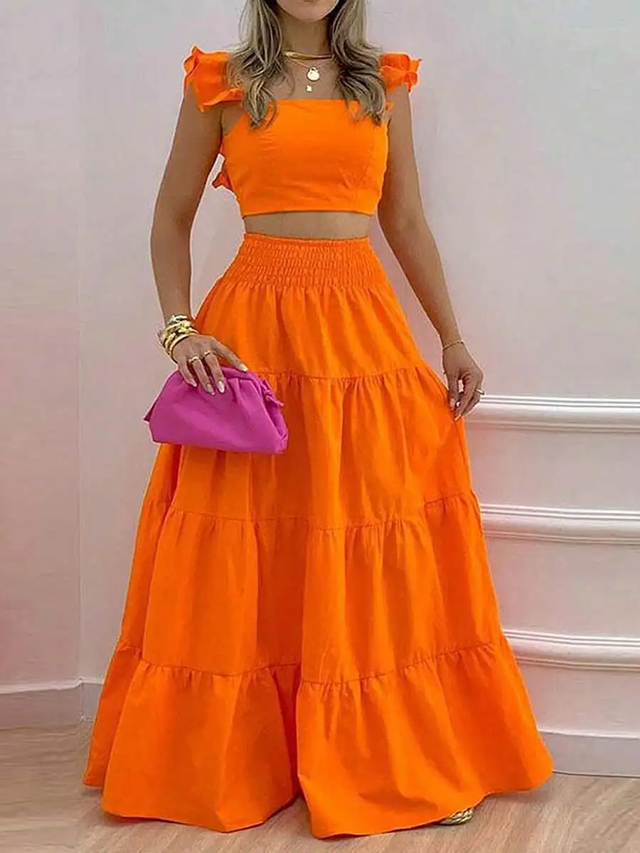 Яркий оранжевый комплект из укороченного топа с открытыми плечами и многоярусной юбки макси для женщин
Яркий оранжевый комплект из укороченного топа с открытыми плечами и многоярусной юбки макси для женщин