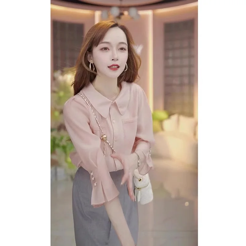 Элегантная шелковая блузка с воротником-бэбидолл, приталенная, модная, летняя, в корейском стиле, однотонная, для повседневной носки
Элегантная шелковая блузка с воротником-бэбидолл, приталенная, модная, летняя, в корейском стиле, однотонная, для повседневной носки