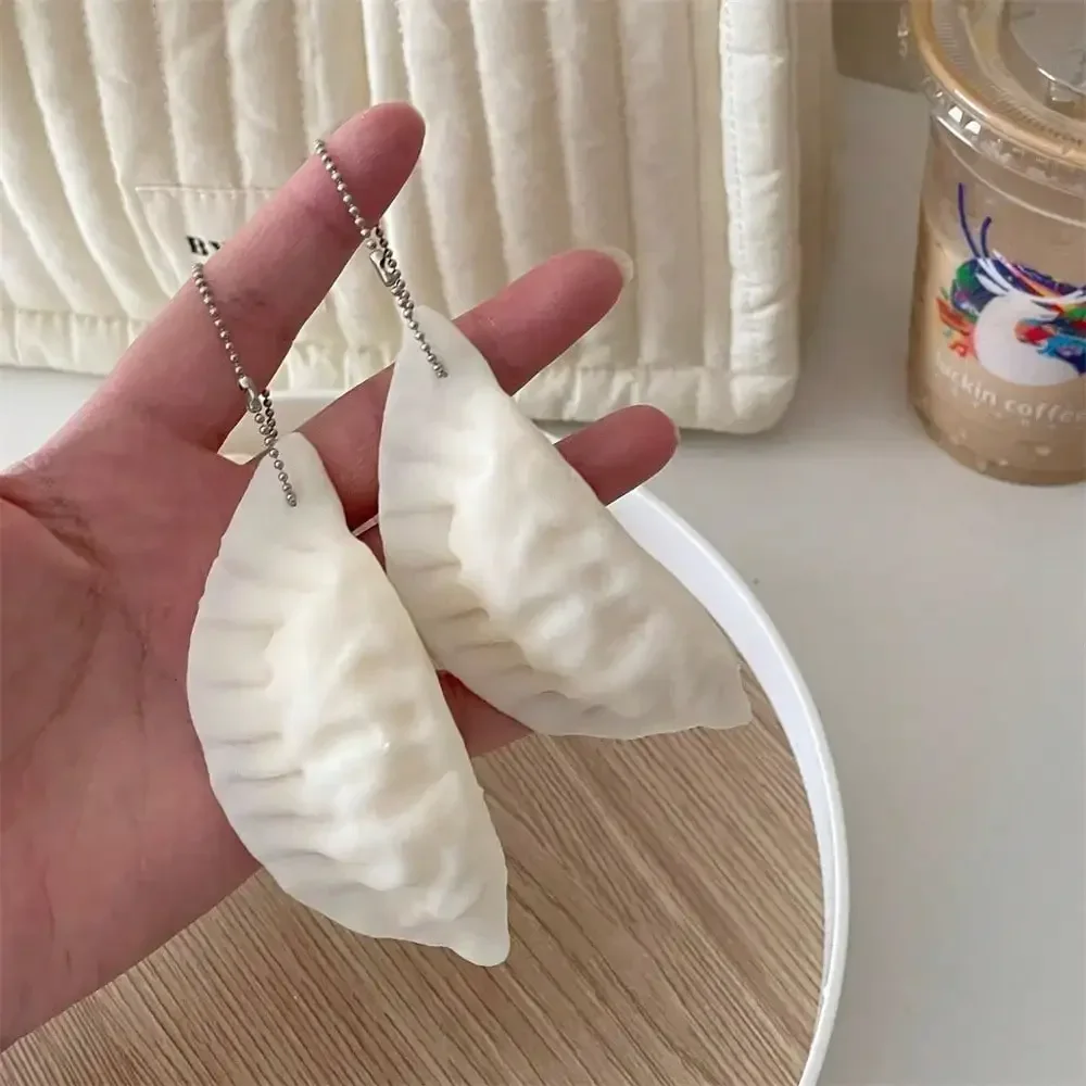 1Pc Creative Realistic Dumpling Squishy Squeeze Fidget Toy Stress Relief Bag Charm Gift for Students Kids Adults Birthday Classroom Party Favors
1Pc Creative Realistic Dumpling Squishy Squeeze Fidget Toy Stress Relief Bag Charm Gift for Students Kids Adults Birthday Classroom Party Favors