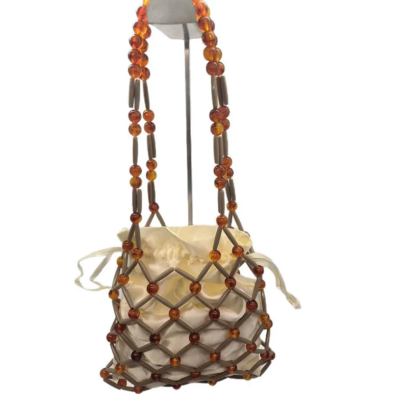 Long Chains Amber Grid Bag Summer Bead Hollow Out Shoulder Bag With Inner Bag Bestseller Panelled Hand-Woven Beach Women Handbag
Long Chains Amber Grid Bag Summer Bead Hollow Out Shoulder Bag With Inner Bag Bestseller Panelled Hand-Woven Beach Women Handbag