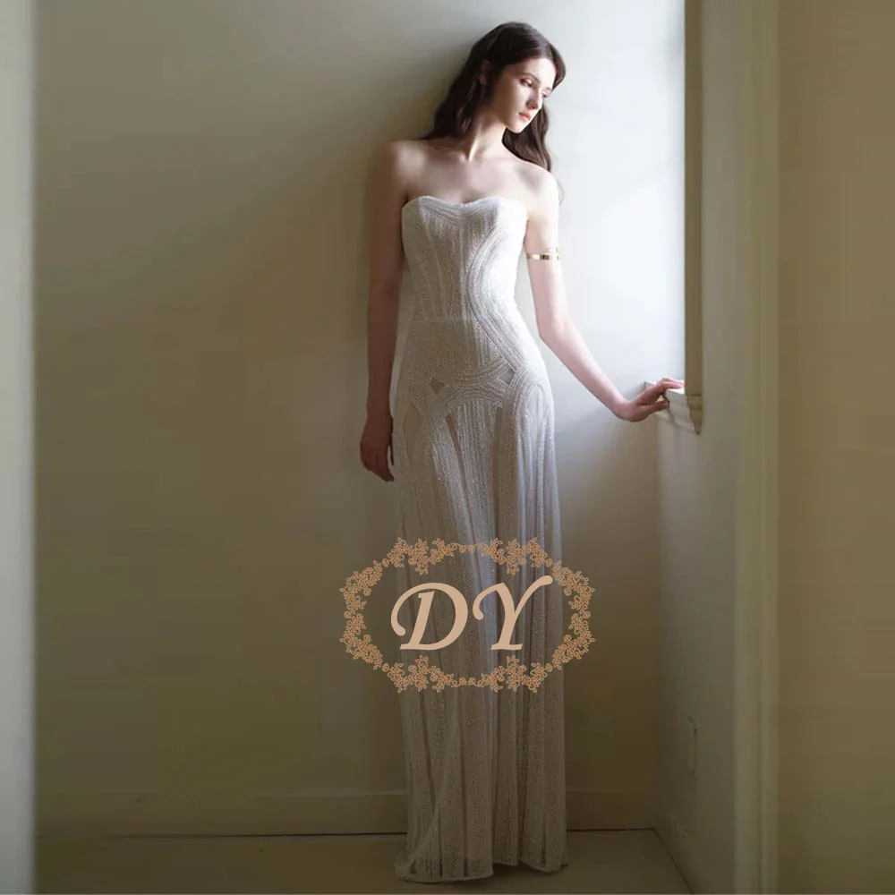Свадебное платье DY Customized Ivory без бретелек с блестящими пайетками, расшитое бисером, длиной в пол, на шнуровке, для торжественных мероприятий
Свадебное платье DY Customized Ivory без бретелек с блестящими пайетками, расшитое бисером, длиной в пол, на шнуровке, для торжественных мероприятий