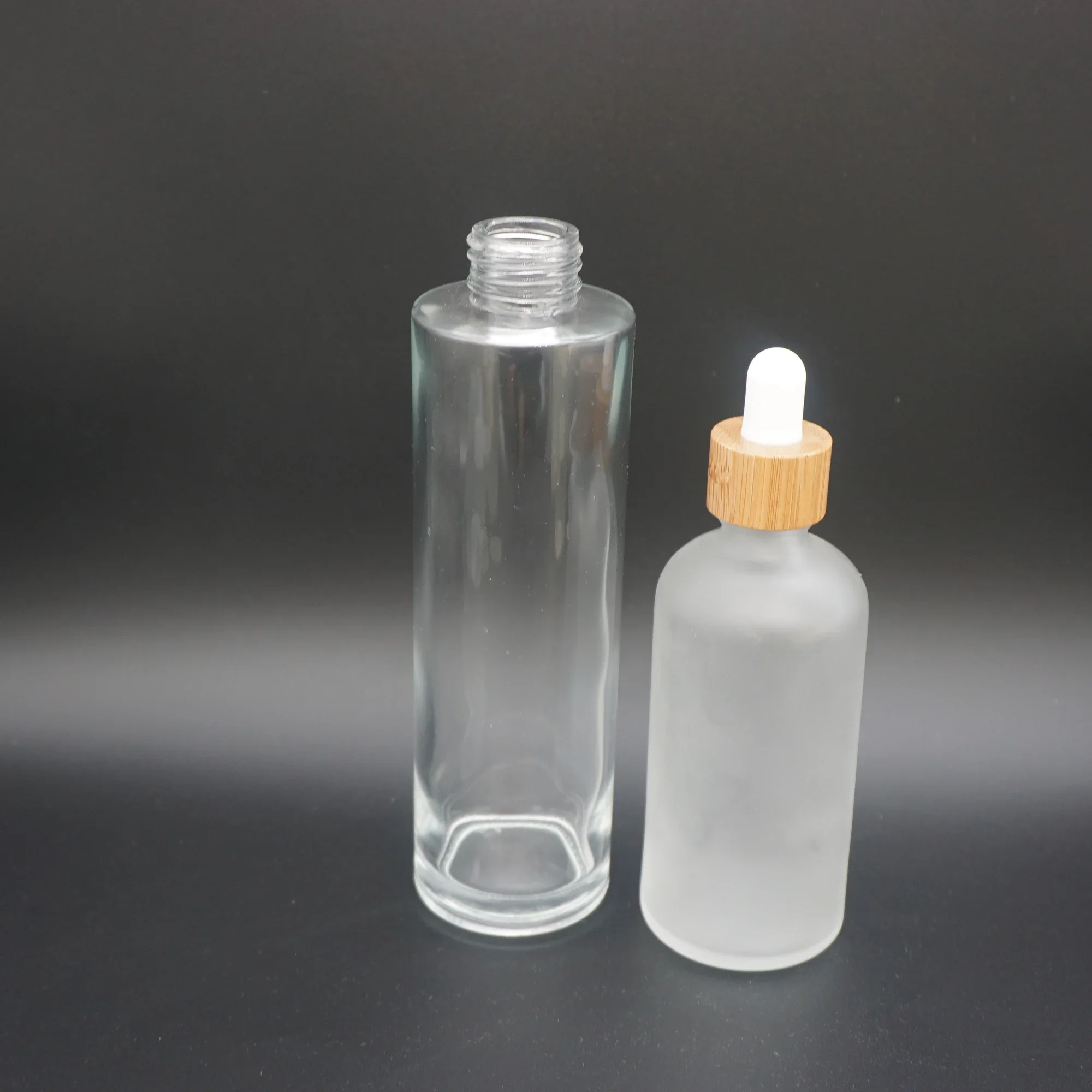 new design Frosted Clear Glass Essential Bottles With Bamboo Cap/Lids Frosted Clear Face Cream Cosmetic Jar With Bamboo Cap
new design Frosted Clear Glass Essential Bottles With Bamboo Cap/Lids Frosted Clear Face Cream Cosmetic Jar With Bamboo Cap