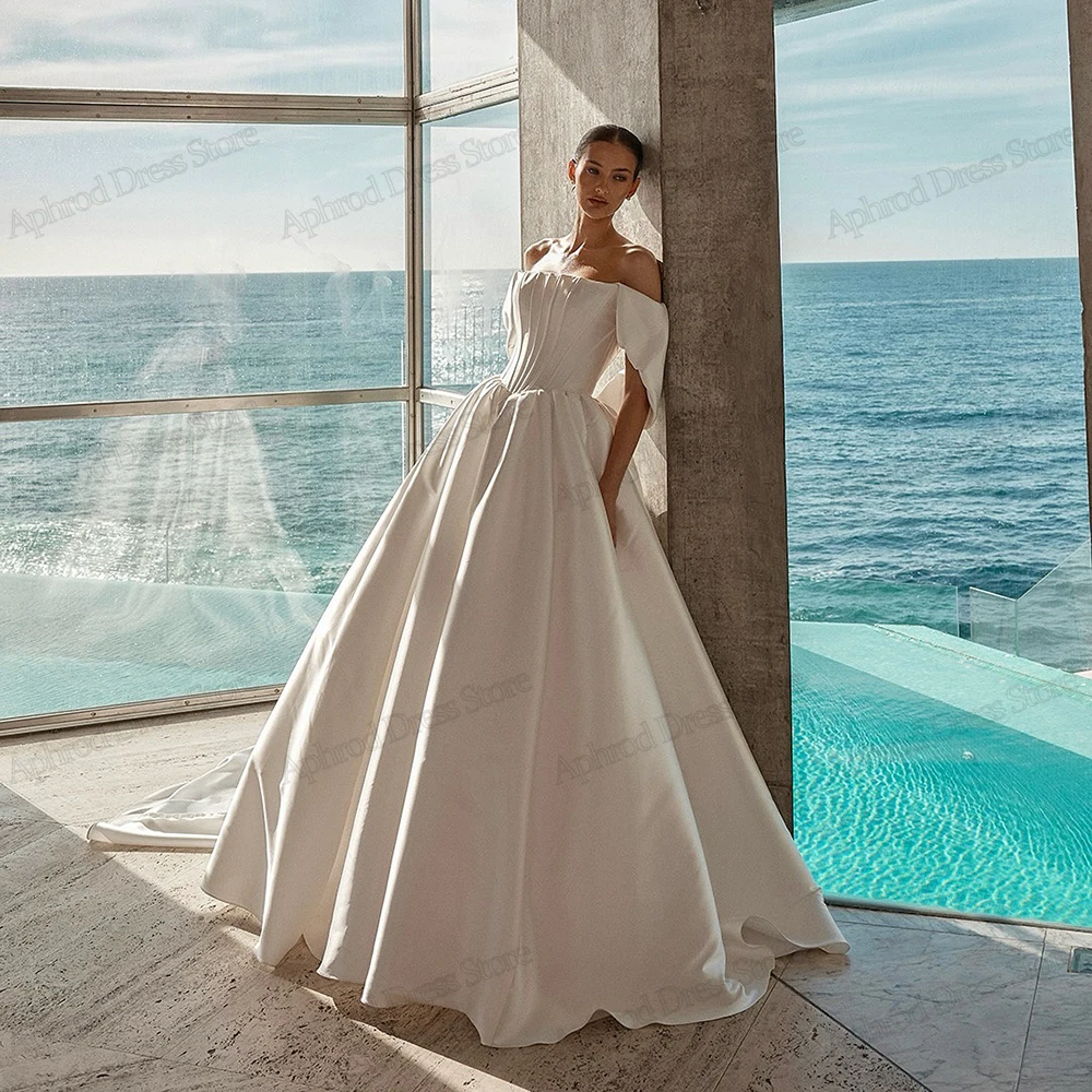 Атласные свадебные платья Простые свадебные платья трапециевидной формы Элегантные халаты для официальной вечеринки с открытыми плечами Vestidos De Novia по индивидуальному заказу 2025
Атласные свадебные платья Простые свадебные платья трапециевидной формы Элегантные халаты для официальной вечеринки с открытыми плечами Vestidos De Novia по индивидуальному заказу 2025