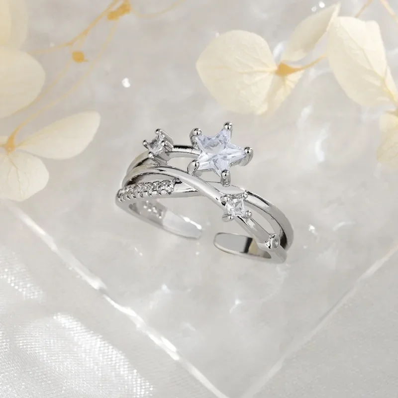 925 Sterling Silver Crossed Surrounding Star Trajectory Zircon Opening Ring for Women Fine Jewelry Minimalist Accessories
925 Sterling Silver Crossed Surrounding Star Trajectory Zircon Opening Ring for Women Fine Jewelry Minimalist Accessories